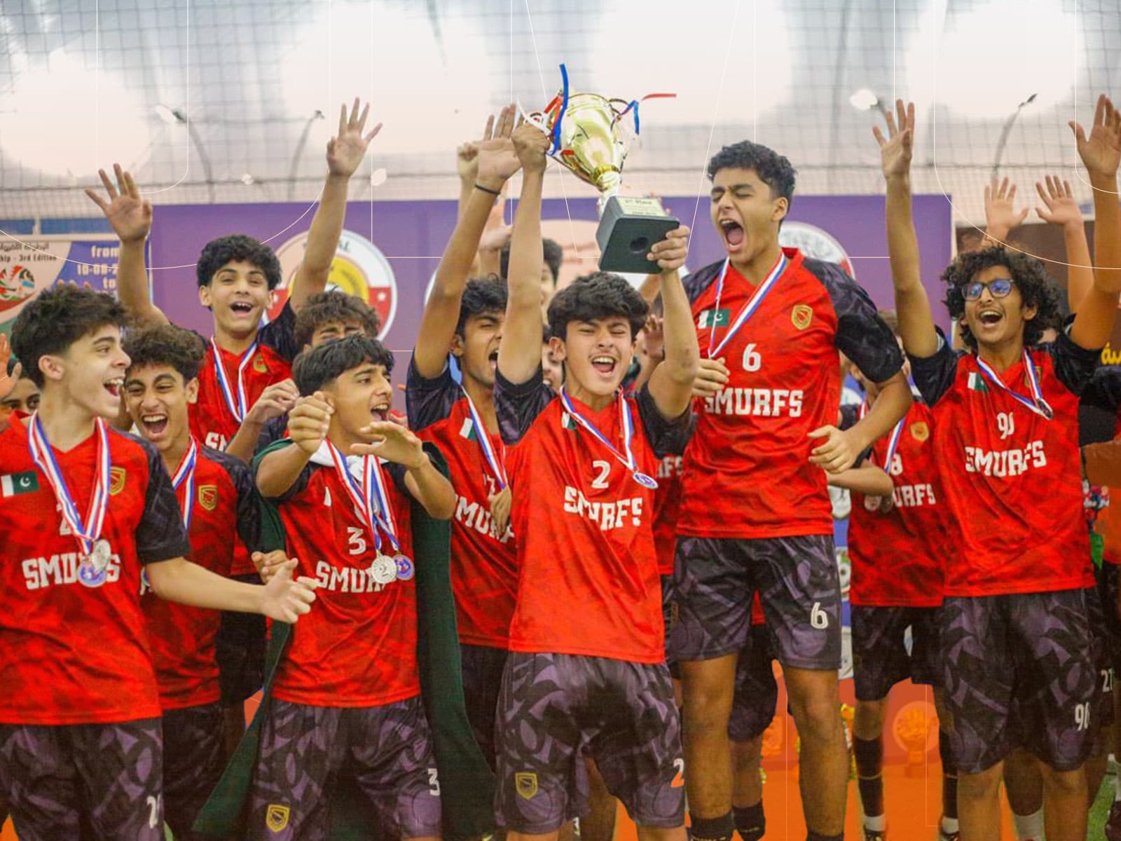 Smurfs Elites celebrating tournament victory with trophy